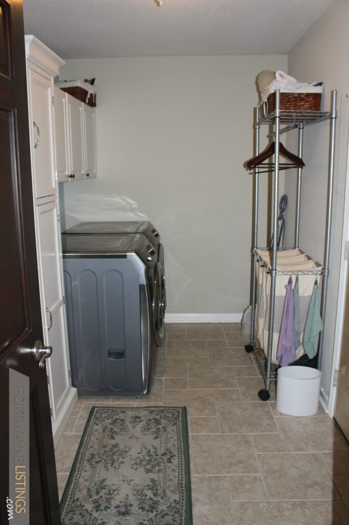 Laundry room leads to garage Super Fort Wayne home for sale
